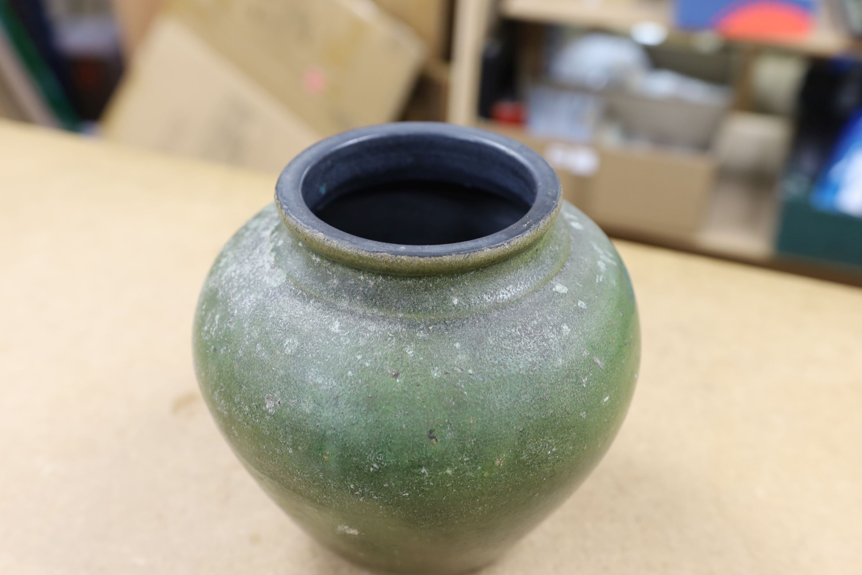 A copper lustre and green glazed pottery jar, 17.5cm high